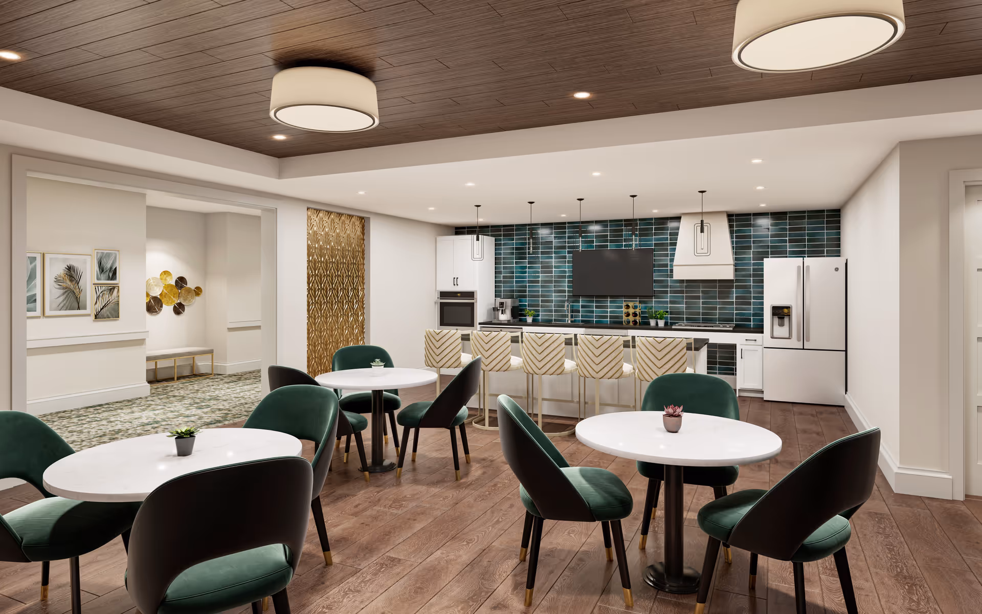 Community dining area with round white tables, green upholstered chairs, and a kitchen island with bar stools in front of a blue tiled backsplash.