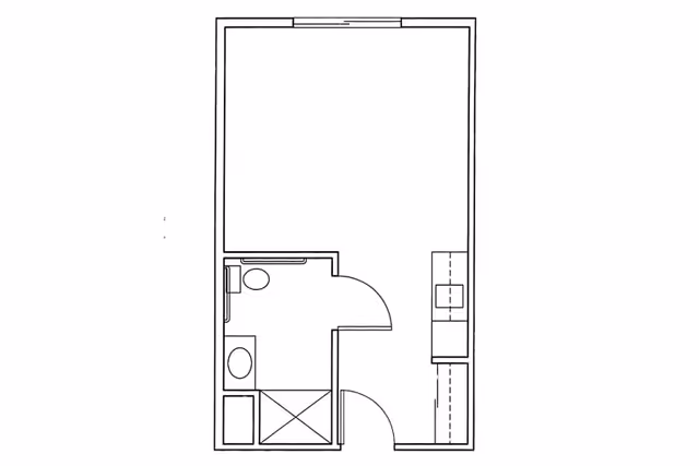 Architectural floor plan of a small living space featuring a bathroom with a toilet, sink, and shower, and an adjacent open area likely for living or sleeping.