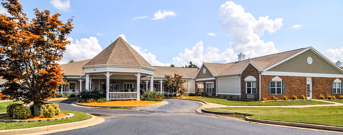 Exterior view of The Neighborhood at Paducah, a senior living campus with a circular driveway.
