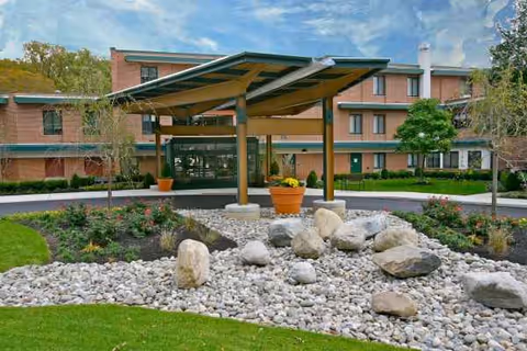 Exterior view of Wesley Enhanced Living at Pennypack Park with entrance canopy.