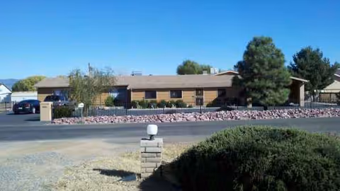 Westfield Assisted Living front exterior: single-story building with driveway, landscaping, and trees.