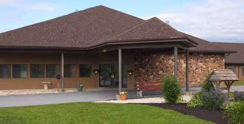 Stonebridge Health and Rehabilitation Center exterior with entrance and manicured lawn.