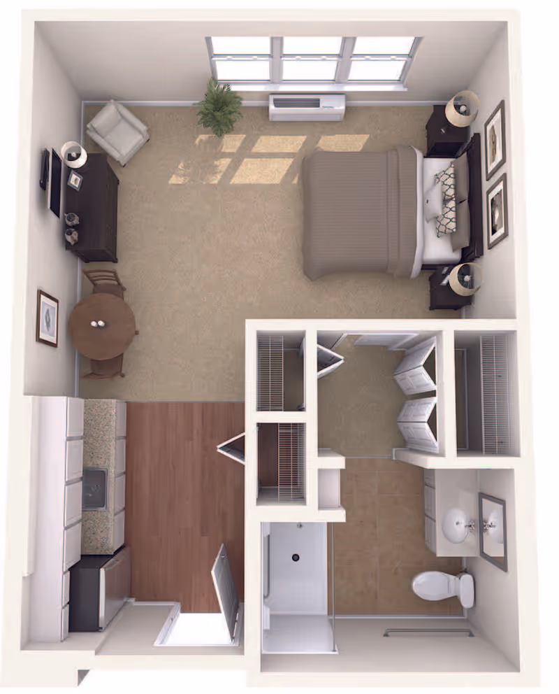 Top-down view of a studio apartment floor plan featuring a bedroom area with a bed, two nightstands with lamps, a dresser with a TV, an armchair, a small round dining table with two chairs, a kitchen area with cabinets, sink, and appliances, a bathroom with a shower, toilet, and sink, and multiple closets. The bedroom area has large windows and a plant near the window.