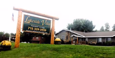 Lakeside Villa Assisted Living sign on a manicured front lawn with a building nearby.
