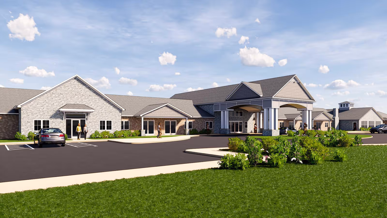 Exterior view of a single-story senior living facility building with a covered entrance, parking spaces, green lawn, and a few people walking near the entrance under a partly cloudy sky.