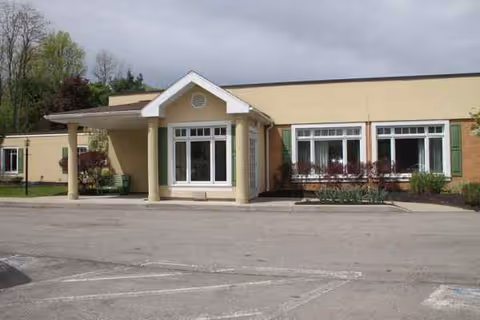 Exterior view of Absolut Care of Gasport entrance with covered porch.