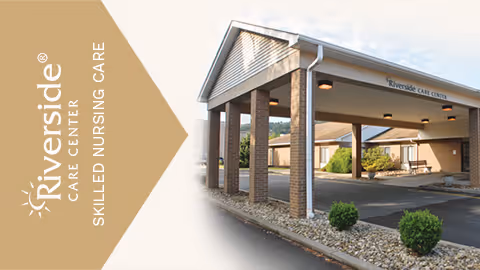 Front entrance of Riverside Care Center with a covered porte-cochere supported by brick columns and landscaped beds.