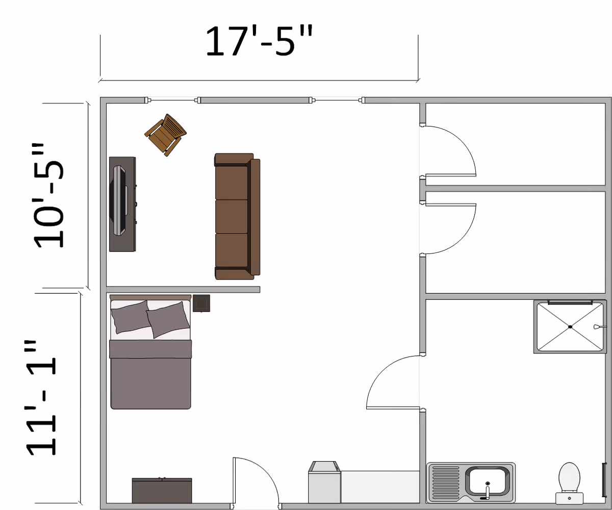 Architectural floor plan of a small living space including a combined living and bedroom area with a sofa, chair, TV, and bed. The plan also shows a bathroom with a shower, toilet, and sink, and a small kitchen area with a sink and counter. Dimensions are marked on the sides.