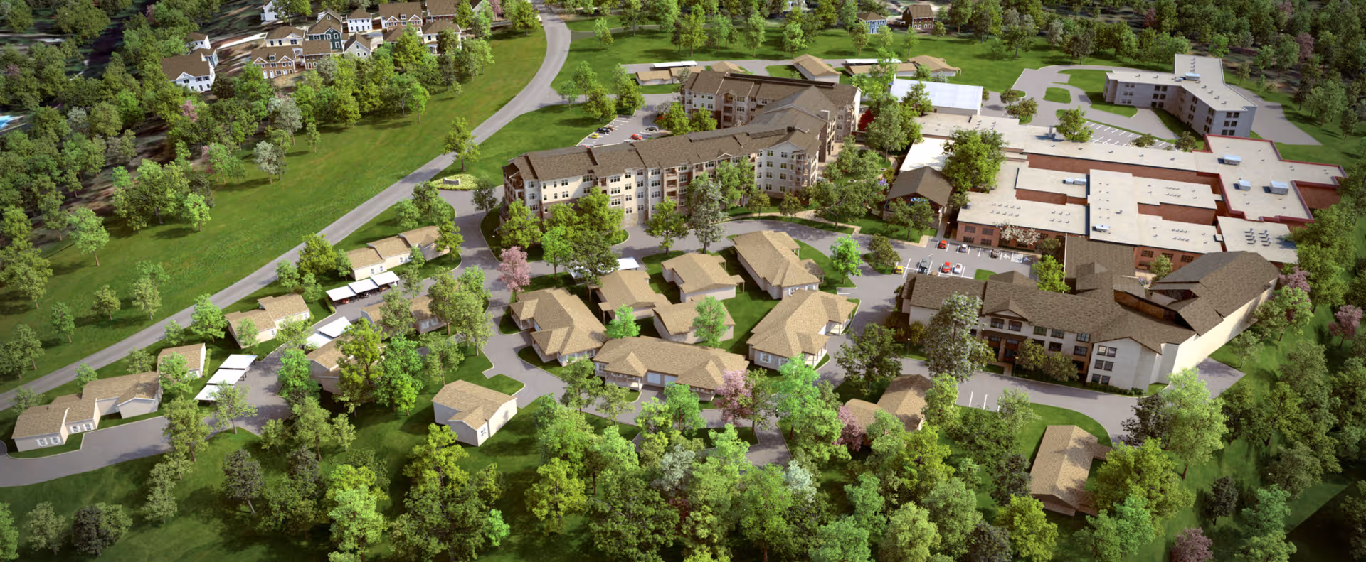 Aerial view of EdenHill Communities senior living facility showing multiple buildings surrounded by green trees and lawns, with roads and parking areas connecting the structures.