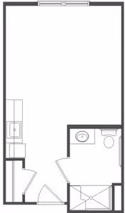 Architectural floor plan showing a small living space with a kitchenette on the left side, a bathroom with a sink, toilet, and shower on the right side, and an open area in the center.