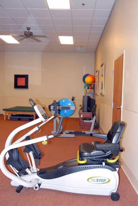 Interior rehab gym at Oasis Center for Rehabilitation and Healing with NuStep machine.