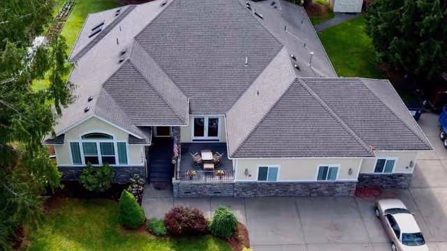 Aerial view of a single-story senior living facility exterior with a front entrance.