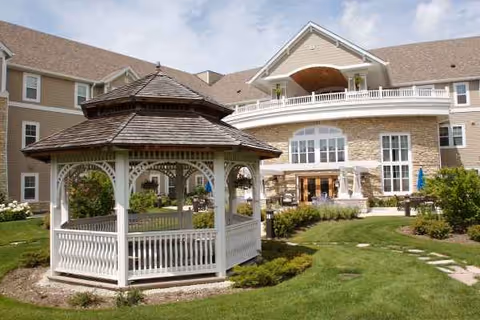 Exterior view of Chestnut Square at the Glen featuring a white gazebo in the courtyard.