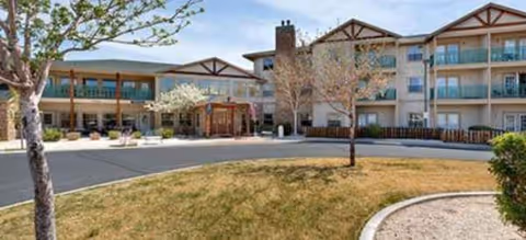 Exterior view of The Chateau at Gardnerville with a courtyard and driveway