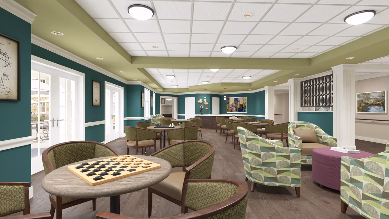 Bright communal lounge/dining area with multiple tables, patterned armchairs, and a checkerboard on the foreground table.