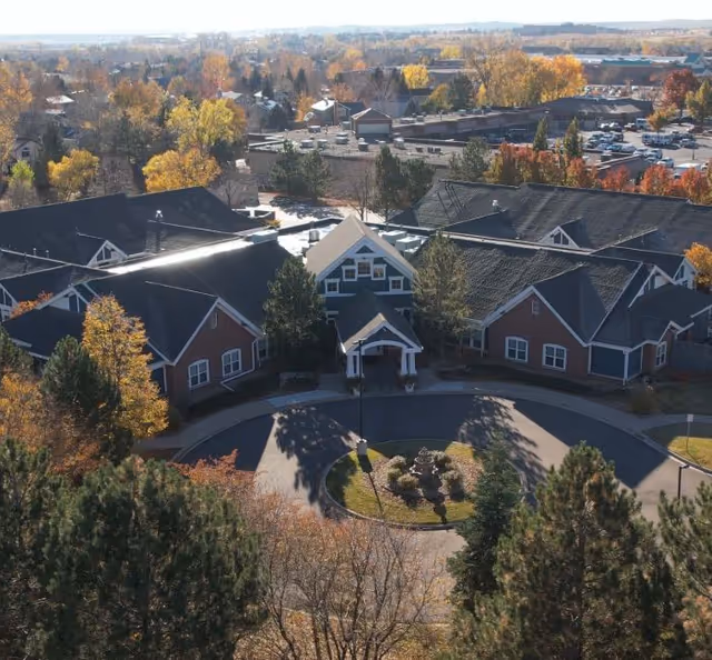Aerial view of Balfour Cherrywood senior living campus with circular driveway and autumn trees.