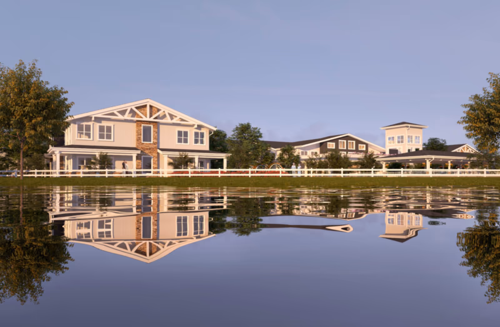 The Watermark at Morrison Ranch campus with beige buildings beside a reflective lake.