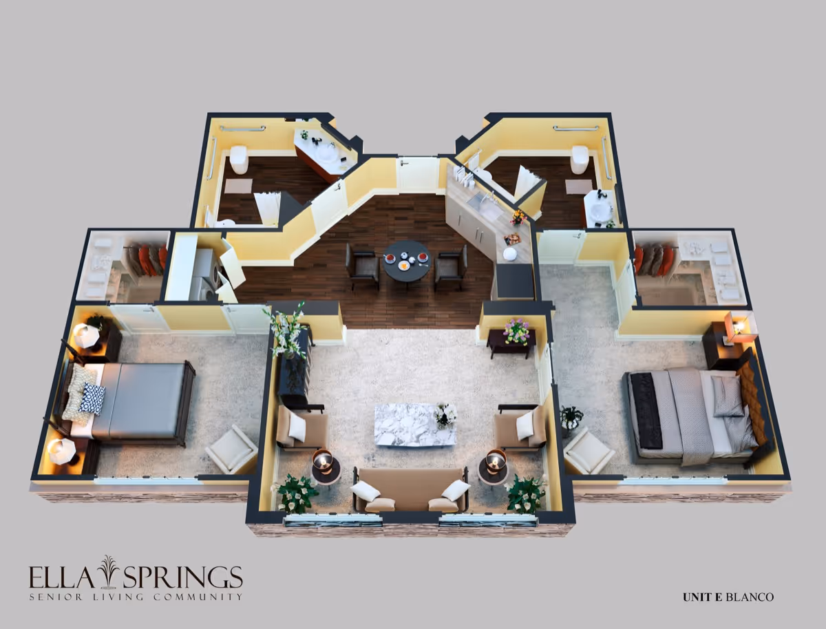 3D floor plan of a senior living community unit showing two bedrooms, two bathrooms, a living room with seating and a coffee table, and a dining area with a round table and four chairs. The bedrooms have beds, nightstands with lamps, and closets. The bathrooms include toilets, sinks, and showers. The living room and dining area have wood flooring, while the bedrooms are carpeted.