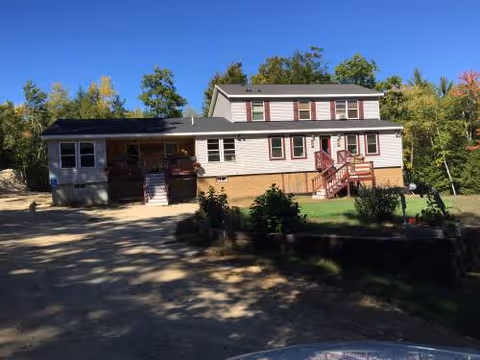 Exterior view of Copp Hill Residential Home for Elderly, a two-story house with a front porch.