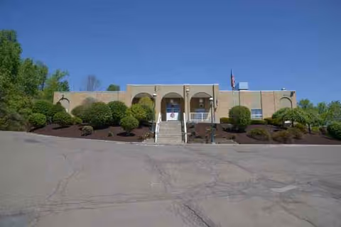 Facade of Absolut Center for Rehabilitation and Nursing with arched entrance.