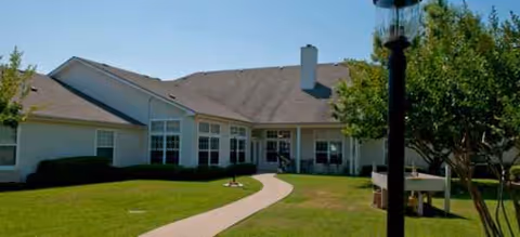 Brookdale Mansfield senior living front exterior with curved walkway and green lawn