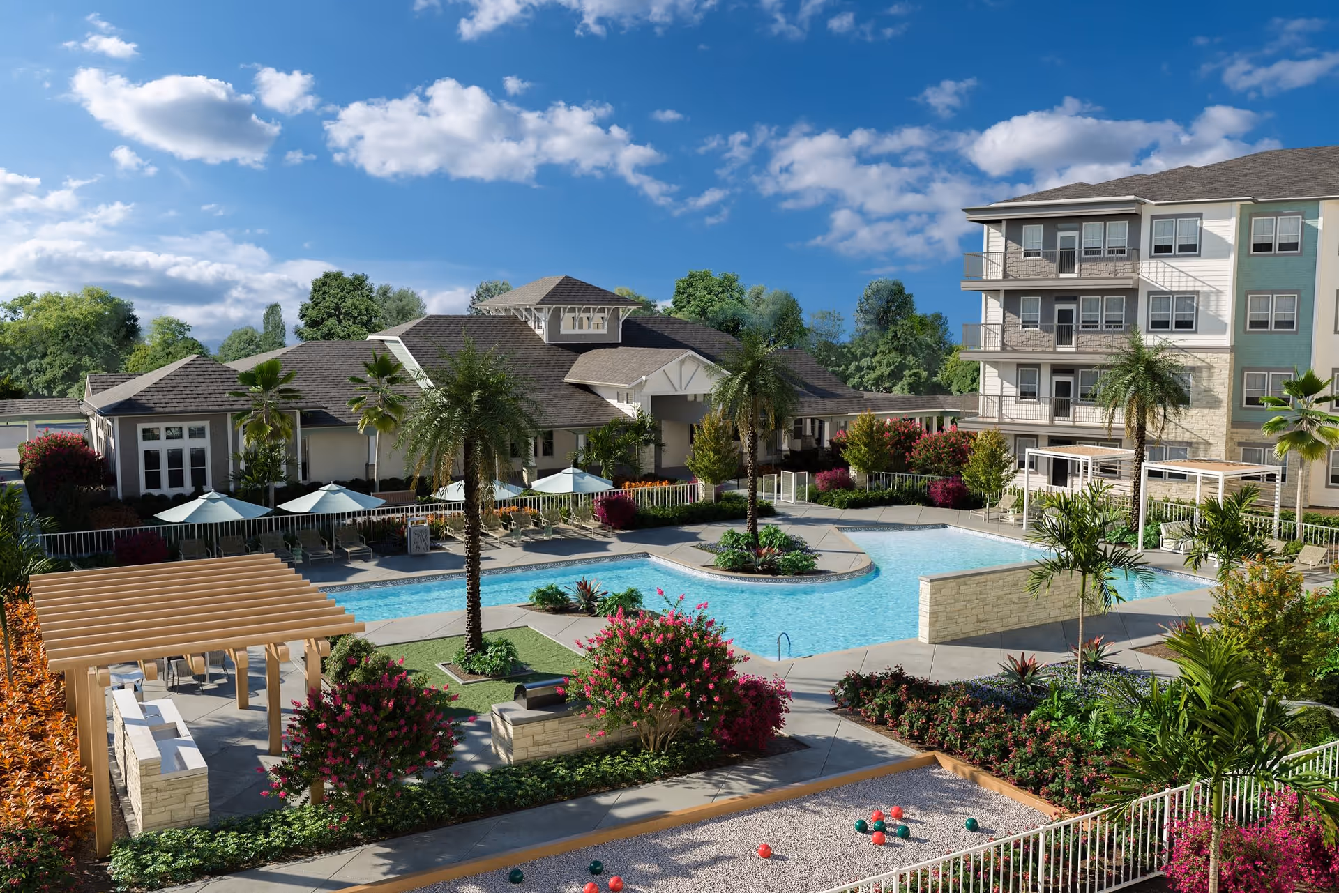 Outdoor view of Amberlin South Naples senior living facility featuring a large swimming pool surrounded by palm trees, lounge chairs with umbrellas, landscaped gardens with colorful flowers, a pergola with seating, and a bocce ball court. The background includes a multi-story residential building and a clubhouse under a partly cloudy blue sky.
