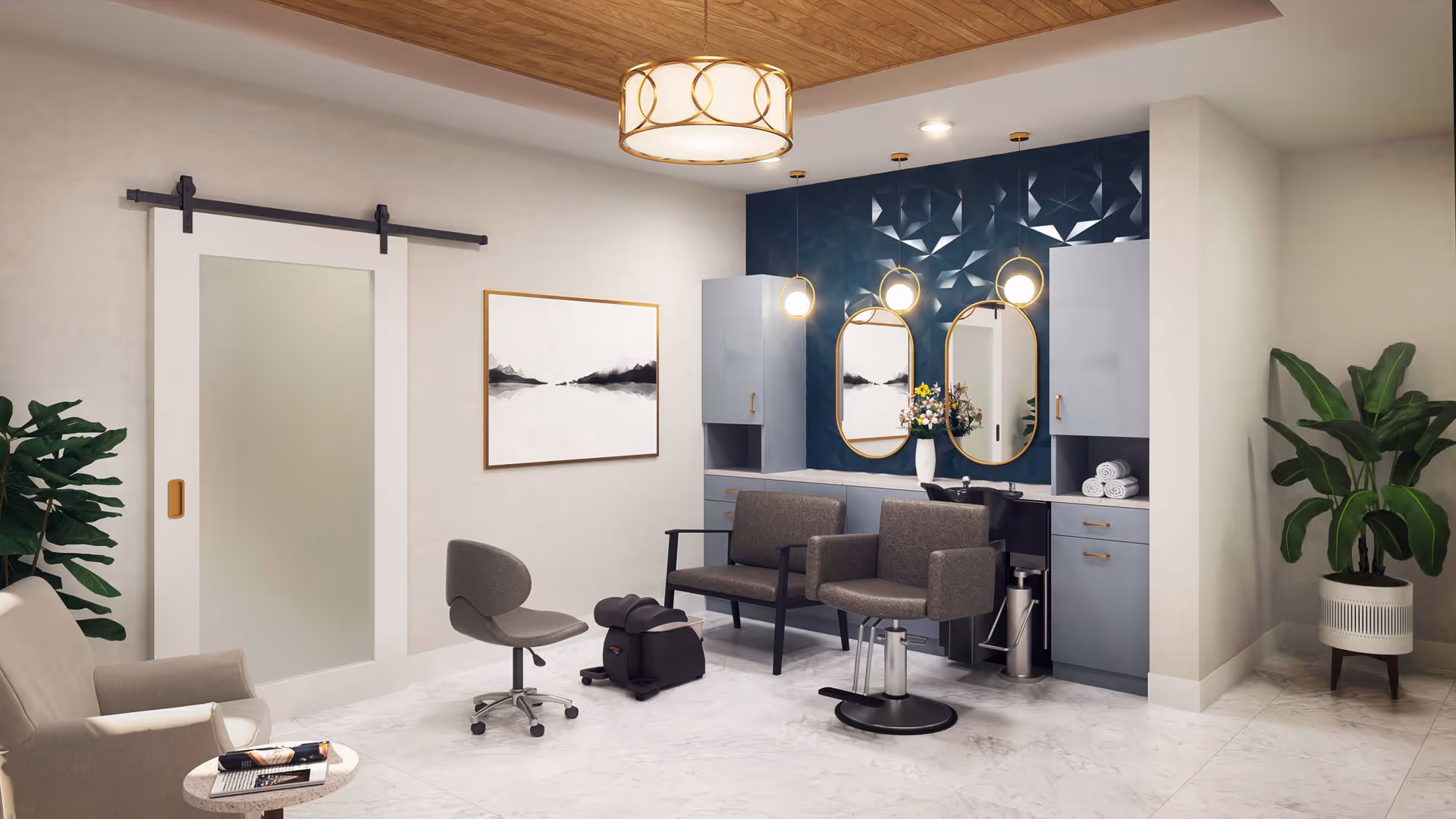 A modern salon area with two styling chairs in front of a blue textured wall with two oval mirrors and pendant lights. There is a small rolling stool and a foot massager on the marble floor. The room also features a beige armchair with a small round table holding magazines, two large green plants in white pots, a sliding frosted glass door, and a wooden ceiling with a circular light fixture.