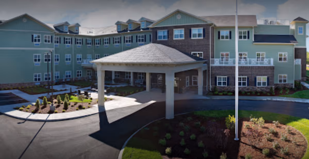 Exterior view of Jubilee House senior living facility with a covered entrance.