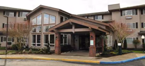 Brookdale Wilsonville senior living facility exterior featuring a covered entrance and brick columns.