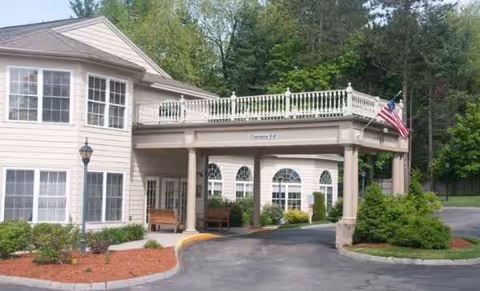 Exterior of Benchmark Senior Living at Leominster Crossings with a covered entrance.