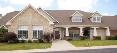 Front view of Landings of Lancaster senior living facility with manicured lawn