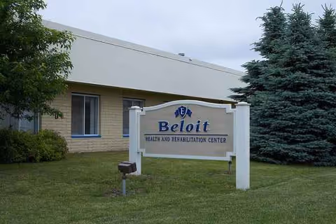 Exterior view of Beloit Health and Rehabilitation Center sign on a grassy front lawn.