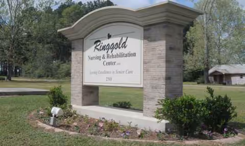 Exterior view of Ringgold Nursing & Rehabilitation Center sign with landscaping.