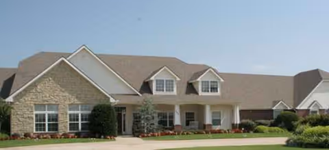 Front exterior of Morada Lake Hefner facility with entry and landscaped lawn