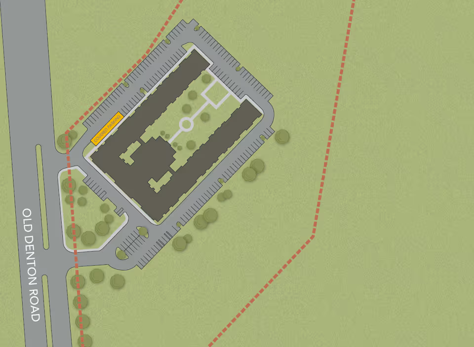 Aerial view map of Emerson at Rosemeade Park facility showing the building layout, surrounding parking lots, pathways, trees, and the adjacent Old Denton Road. The building is shaped like a U with a courtyard in the center. There is a labeled covered parking area on the left side of the building.