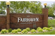 Brick entrance sign reading Fairhaven Nursing Home with surrounding greenery.