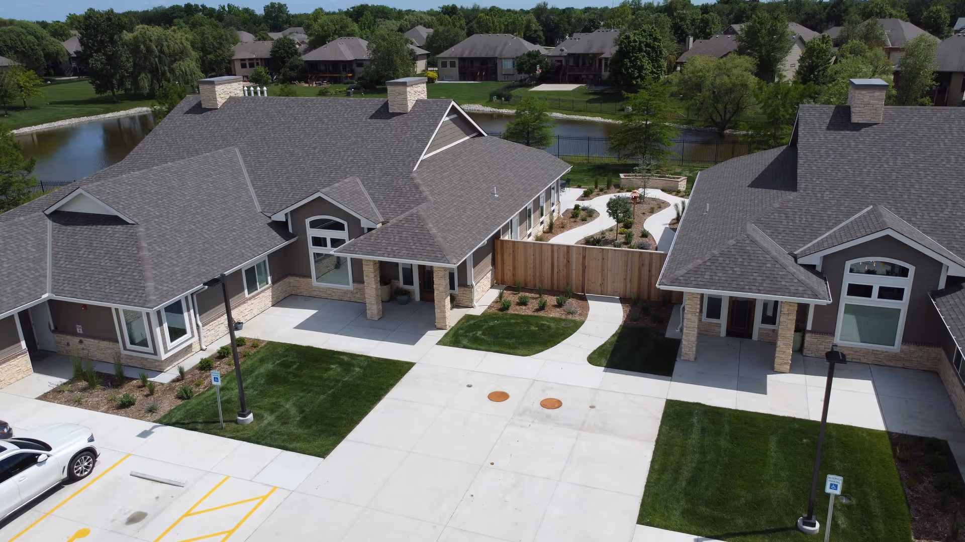 Bird's-eye view of ComfortCare Homes West campus with connected buildings and manicured outdoor spaces.
