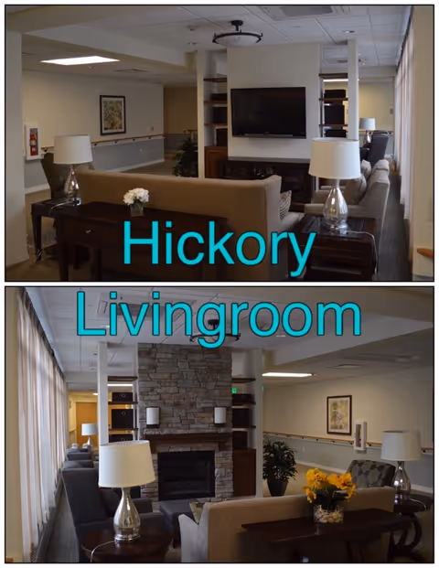Communal living room with sofas, side tables and lamps, a wall-mounted TV and a stone fireplace.