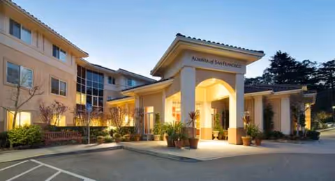 Exterior view of AlmaVia of San Francisco entrance with a covered entry and landscaping.