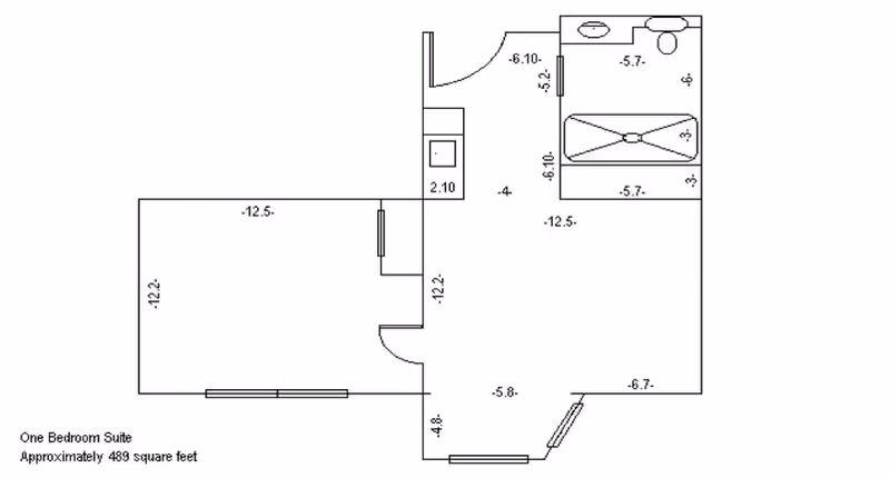 Architectural floor plan of a one-bedroom suite approximately 489 square feet, showing layout with labeled dimensions including a bedroom, bathroom, and living area.