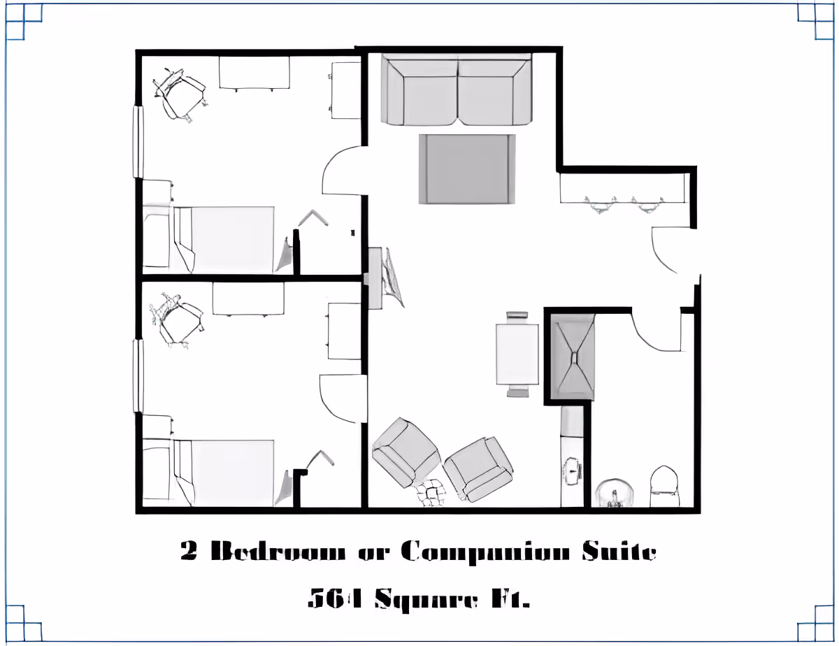 Floor plan of a 2 bedroom or companion suite with 561 square feet, showing two bedrooms each with a bed and desk, a living area with sofa, chairs, and table, a small kitchen area, and a bathroom with sink and toilet.