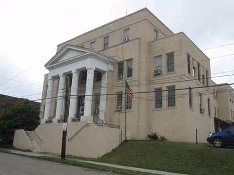 Exterior view of Serene Manor Medical Center with a columned entrance and steps.