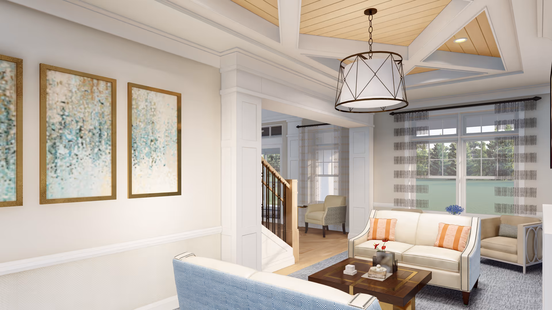A bright and spacious living room in a senior living facility featuring two cream-colored sofas with orange striped pillows, a wooden coffee table with decorative items, large windows with sheer striped curtains, a modern ceiling light fixture, and abstract artwork on the wall. The room has light-colored walls, a coffered ceiling, and a staircase visible in the background.