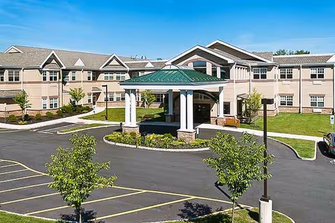 Exterior view of Foothill Acres Rehabilitation & Nursing Center with the main entrance canopy and parking.