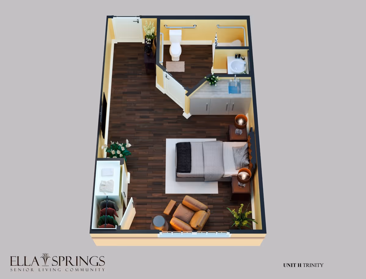 3D floor plan of a senior living unit featuring a bedroom with a bed, two bedside tables with lamps, a comfortable armchair with an ottoman, a small round table, a closet with hanging clothes, a kitchenette with a sink and cabinets, and a bathroom with a toilet, sink, and shower. The flooring is dark wood, and there are plants and decorative items throughout the space.