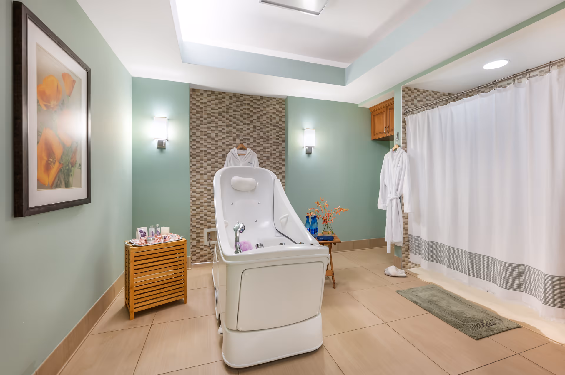 Spa-like accessible bathroom with a walk-in bathtub, shower curtain, robe, and decorative accents.