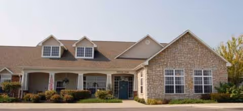 Front view of Brookdale Great Bend senior living facility, brick exterior with covered porch and landscaping.
