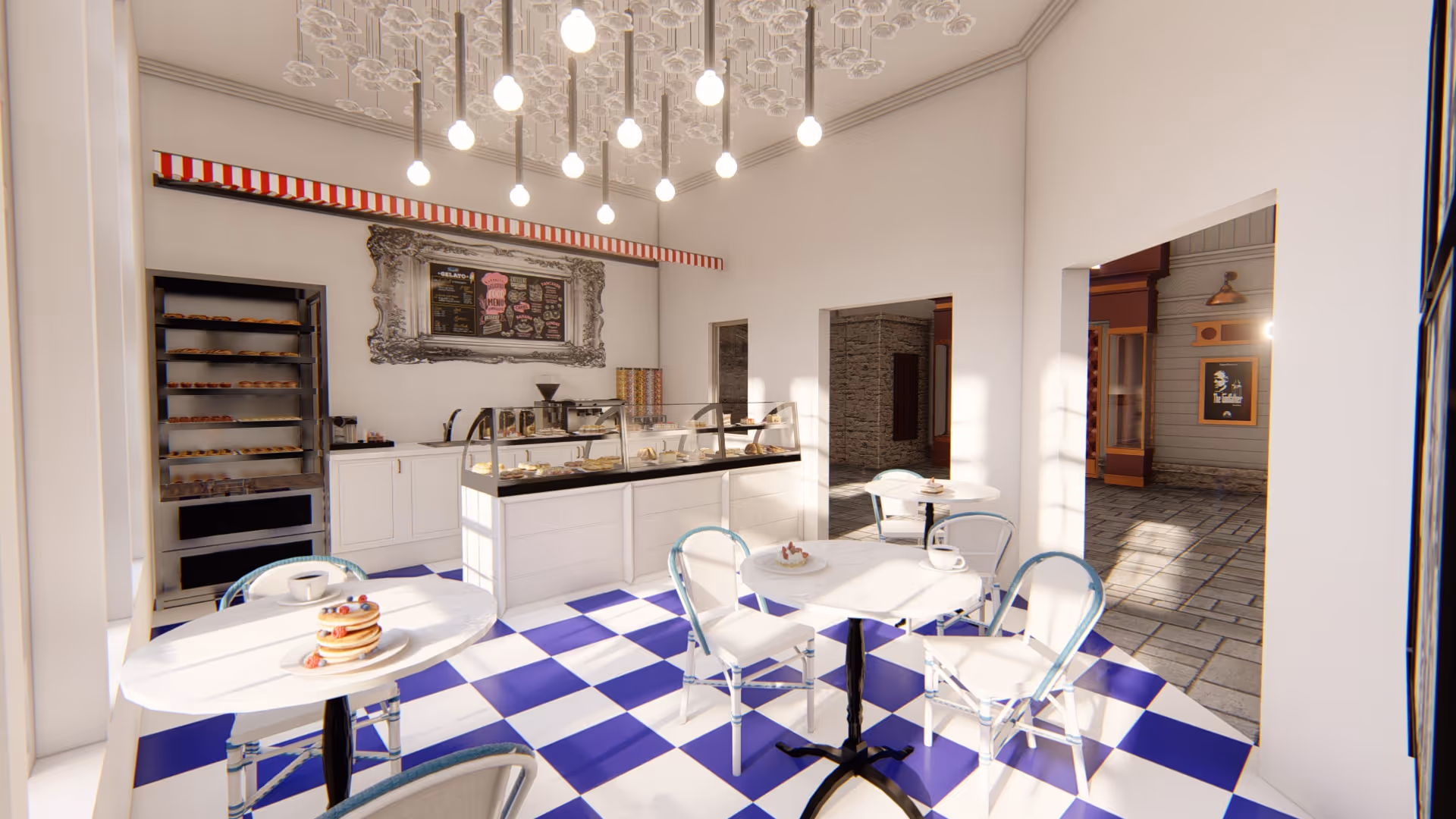 Bright and clean cafe-style dining area with white walls and a blue and white checkered floor. There are several small white tables with white chairs featuring blue accents. On the tables are plates with pastries and cups of coffee. A display counter with baked goods and a menu board is visible against the back wall. The ceiling has hanging light bulbs and decorative glass elements. The room opens to an outdoor paved area with storefront-style decor.