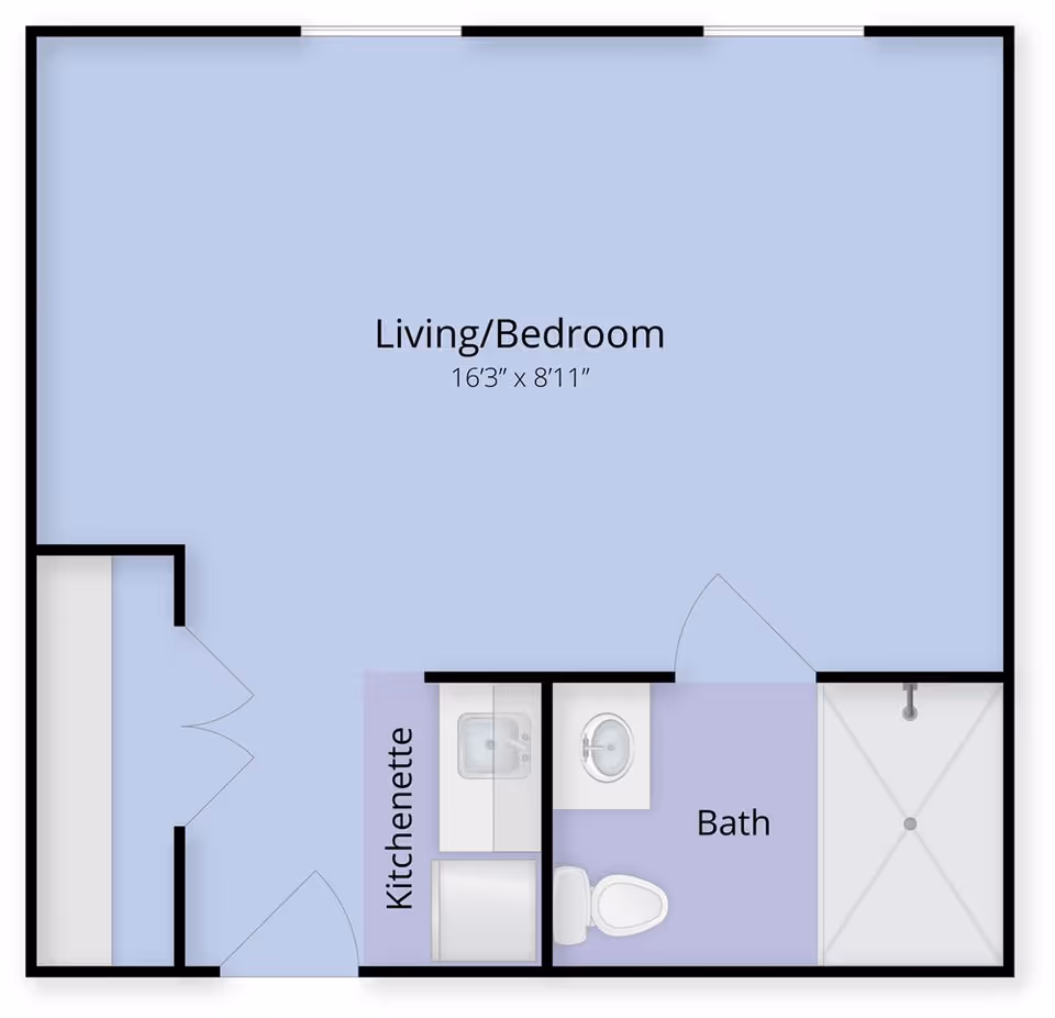 Floor plan of a studio apartment showing a large living/bedroom area, a kitchenette, and a bathroom with shower.