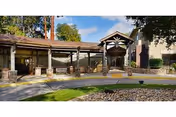 Exterior view of Summer House Memory Care at Sunny View entrance with a covered walkway.